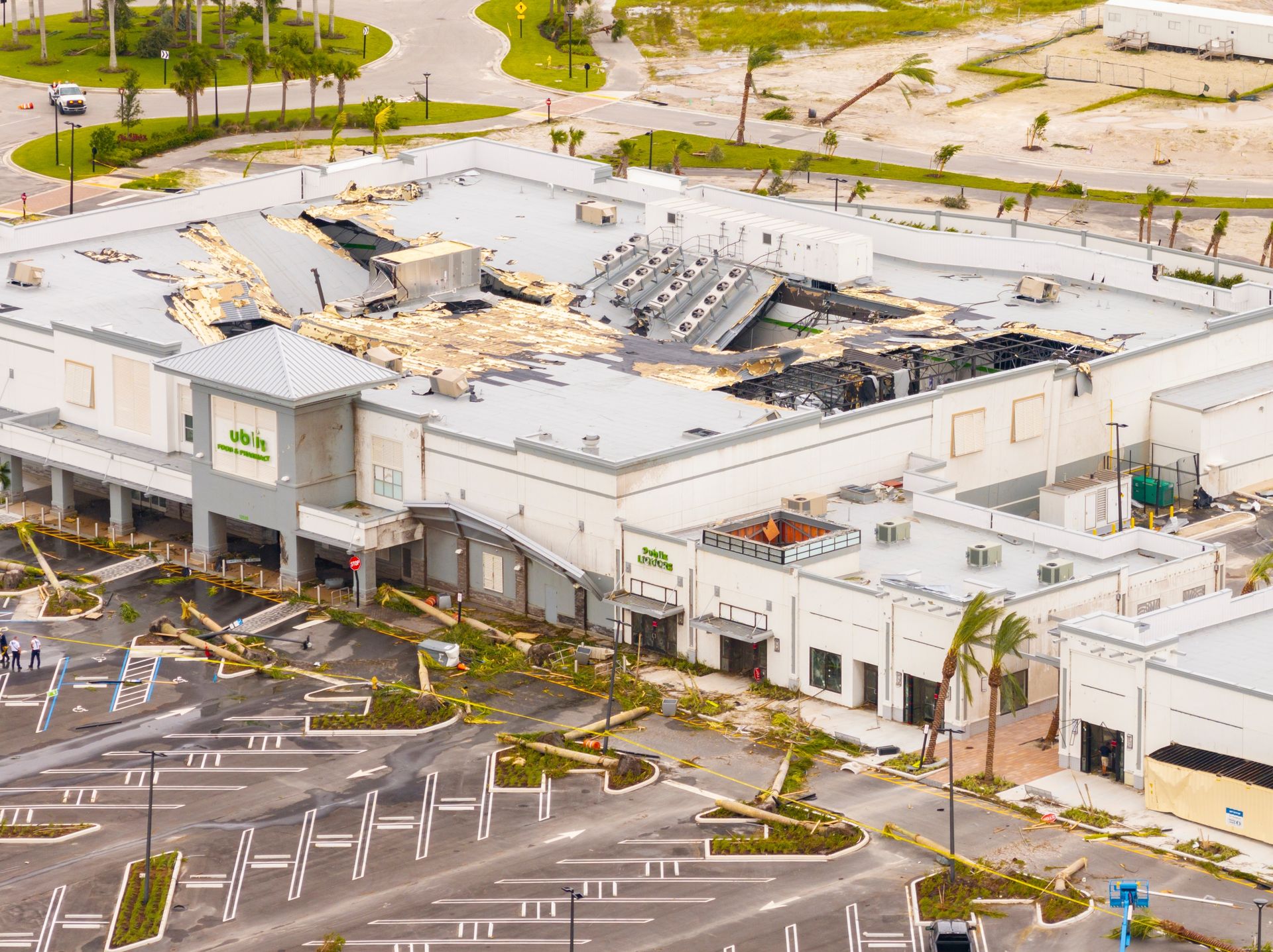 Storm-damaged commercial roof membrane after a catastrophe event